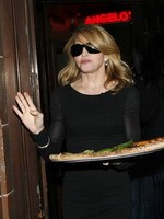 Madonna eating a pizza with David Letterman at Angelo's Pizza