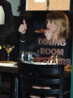 Madonna eating a pizza with David Letterman at Angelo's Pizza