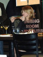 Madonna eating a pizza with David Letterman at Angelo's Pizza