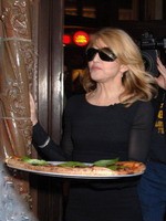 Madonna eating a pizza with David Letterman at Angelo's Pizza