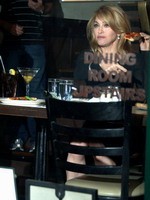 Madonna eating a pizza with David Letterman at Angelo's Pizza