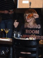 Madonna eating a pizza with David Letterman at Angelo's Pizza