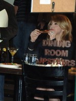 Madonna eating a pizza with David Letterman at Angelo's Pizza