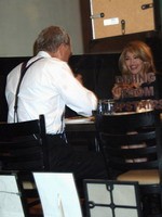 Madonna eating a pizza with David Letterman at Angelo's Pizza