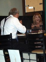 Madonna eating a pizza with David Letterman at Angelo's Pizza