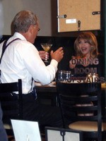 Madonna eating a pizza with David Letterman at Angelo's Pizza