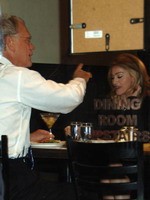 Madonna eating a pizza with David Letterman at Angelo's Pizza