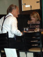 Madonna eating a pizza with David Letterman at Angelo's Pizza