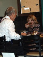 Madonna eating a pizza with David Letterman at Angelo's Pizza