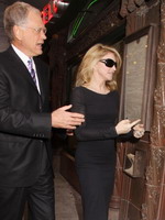 Madonna eating a pizza with David Letterman at Angelo's Pizza